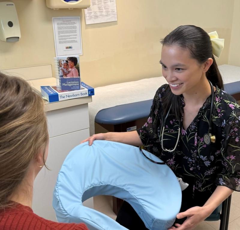 a female medical provider smiling at a patient