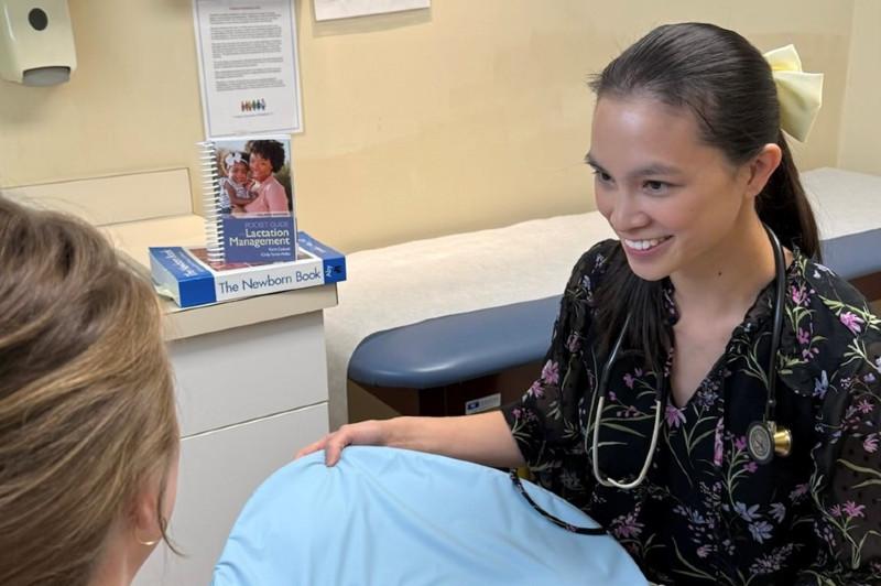 a female medical professional smiling